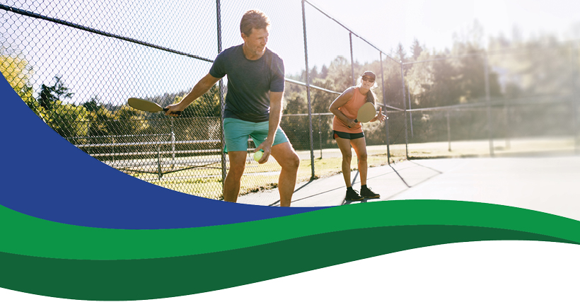 couple playing pickleball
