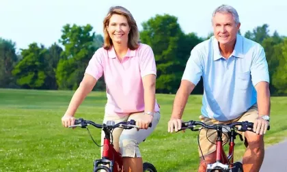 older couple riding bikes together