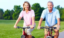 older couple riding bikes together